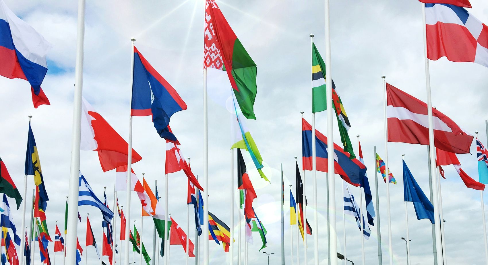 National flags of many countries flying together